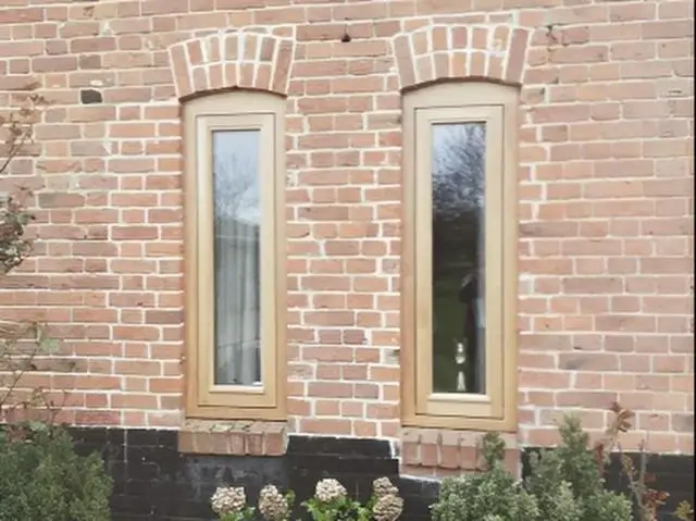 Pair of tall windows beneath arched brick heads